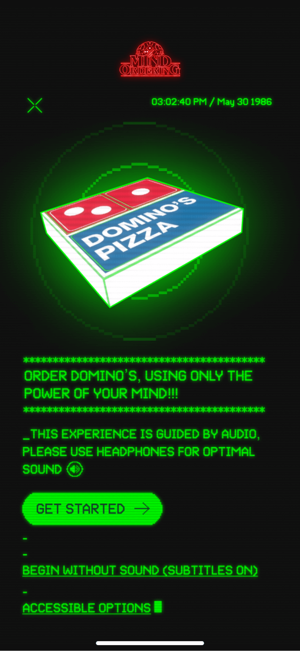 Landing screen featuring a spinning Domino's pizza box, styled to look like 1980s computer UI.